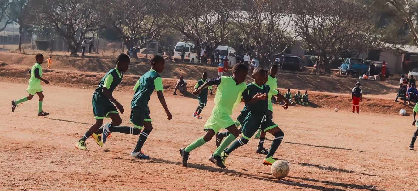02-2024-archive-manzini A photograph from the 2024 Games at Manzini Club, showing several young players in action