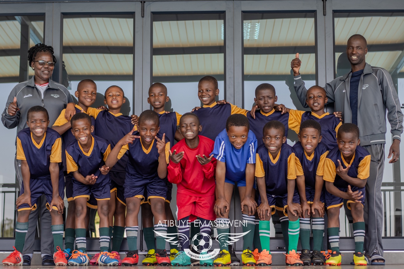 Players and their coaches at Nkonyeni College.]